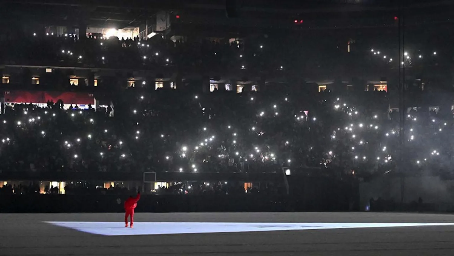 Kanye West performs his songs at the "DONDA by Kanye West" listening event at the first Donda listening party, in the Mercedes-Benz Stadium. West's most recent album was released through labels GOOD Music and Def Jam Recordings and is named after his mother. 