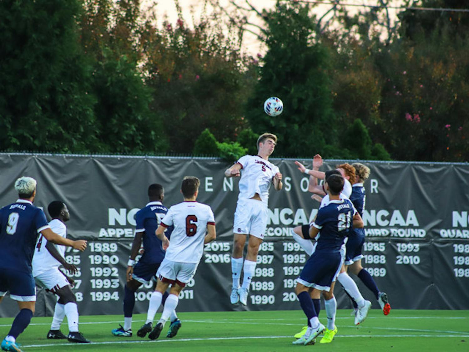 Freshman defensive midfielder William Nilsson hits a header during the South Carolina's matchup against Queens University on Sept. 20, 2022. The Gamecocks beat the Royals 3-1.