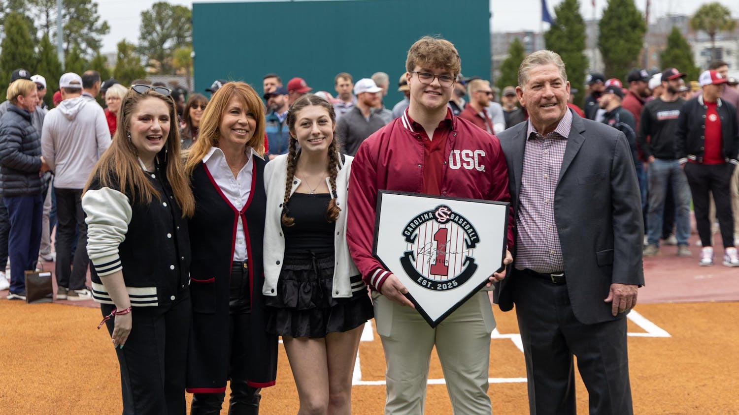 FILE — Ray Tanner (far right) poses with family members during a ceremony to dedicate the field at Founders Park to Tanner before a game on Feb. 15, 2025. Tanner previously served as a baseball coach and athletic director for South Carolina, leading the baseball team to back-to-back National Championships as head coach.