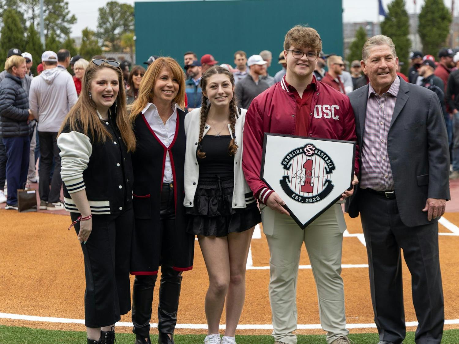 FILE — Ray Tanner (far right) poses with family members during a ceremony to dedicate the field at Founders Park to Tanner before a game on Feb. 15, 2025. Tanner previously served as a baseball coach and athletic director for South Carolina, leading the baseball team to back-to-back National Championships as head coach.