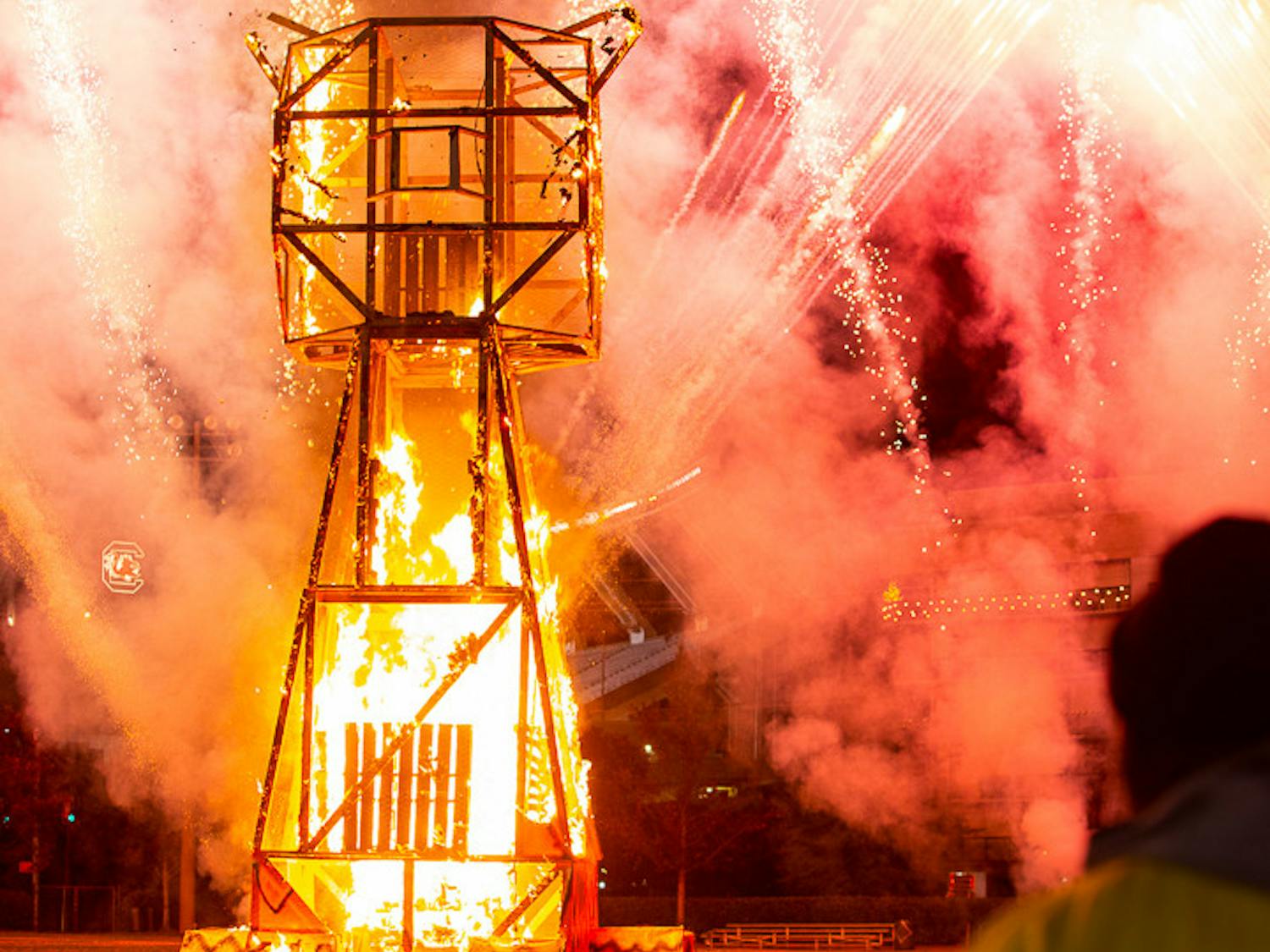 The Clemson Tiger statue was set ablaze during the Tiger Burning ceremony and within five minutes was nearly entirely burnt. The firework show rages on in the background as the crowd cheers.