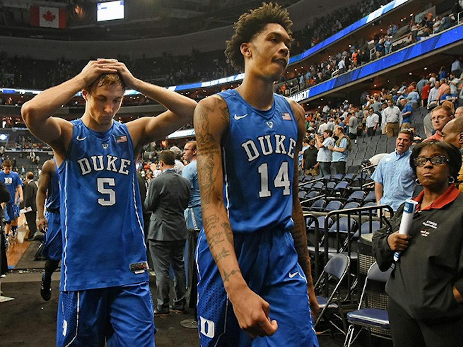 Duke guard Luke Kennard (5) and guard Brandon Ingram (14) leave the floor after losing in overtime to Notre Dame 84-79 at the ACC Tournament at the Verizon Center on March 10, 2016 in Washington, D.C. (Chuck Liddy/Raleigh News & Observer/TNS)