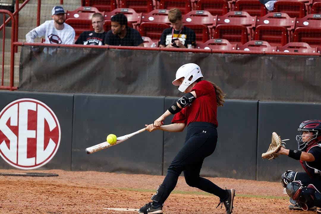 Freshman catcher Hannah Hawley makes contact with the ball during the Garnet and Black Scrimmage at Beckham Field on Nov. 5, 2022. Hawley ranked 11th best catcher in the class of 2022 by Extra Inning Softball.