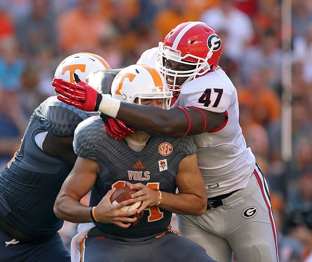 Georgia defensive end Ray Drew (47) sacks Tennessee quarterback Justin Worley in the first half at Neyland Stadium in Knoxville, Tennessee, on Saturday, October 5, 2013. (Jason Getz/Atlanta Journal-Constitution/MCT)