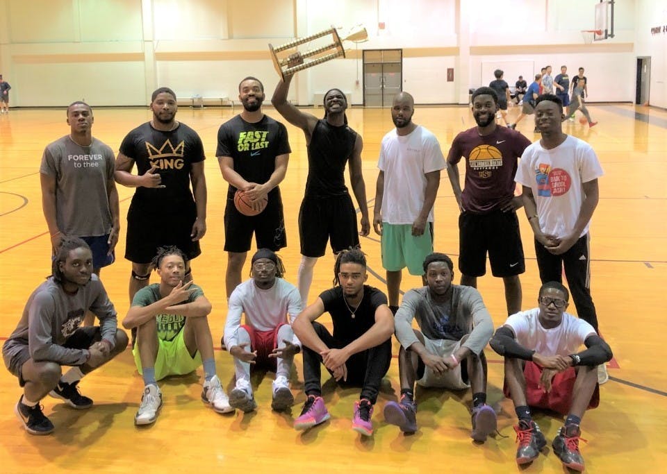 Students and mentors celebrate after the B2B student basketball tournament.&nbsp;
