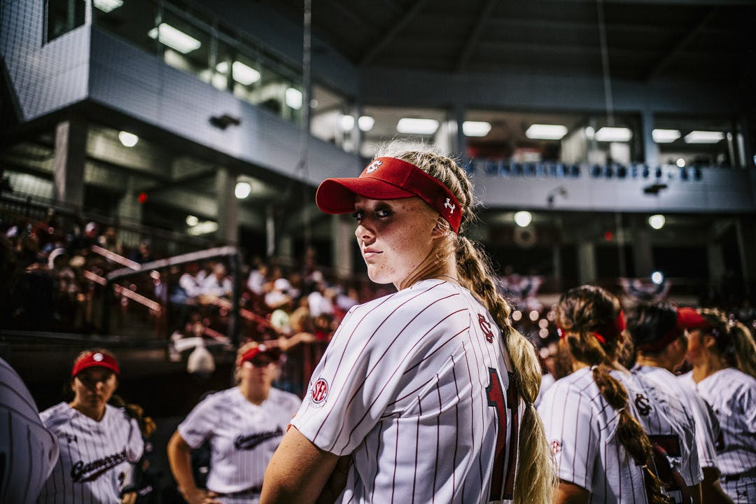 Fifth-year outfielder Haley Simpson peaks back at the camera during player introductions at the South Carolina vs. College of Charleston game on February 15, 2023. The Gamecocks beat the Cougars 8-0.&nbsp;