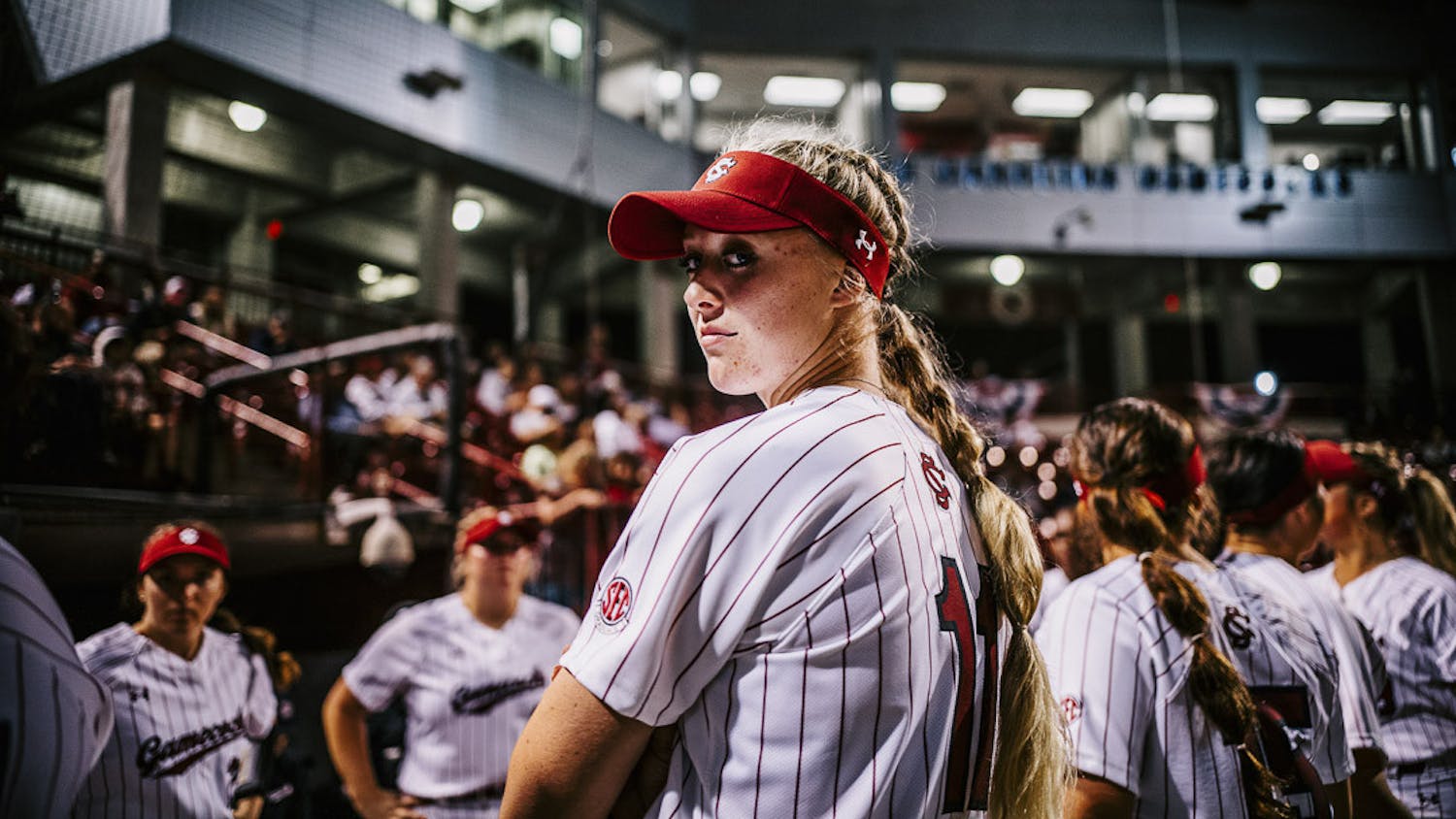 Fifth-year outfielder Haley Simpson peaks back at the camera during player introductions at the South Carolina vs. College of Charleston game on February 15, 2023. The Gamecocks beat the Cougars 8-0.&nbsp;