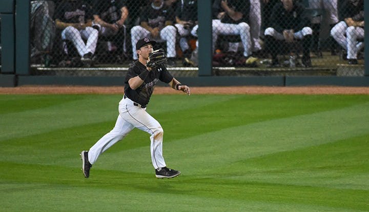 Gamecock junior outfielder Brady Allen runs to catch the ball after it was hit by the opposing team.&nbsp;