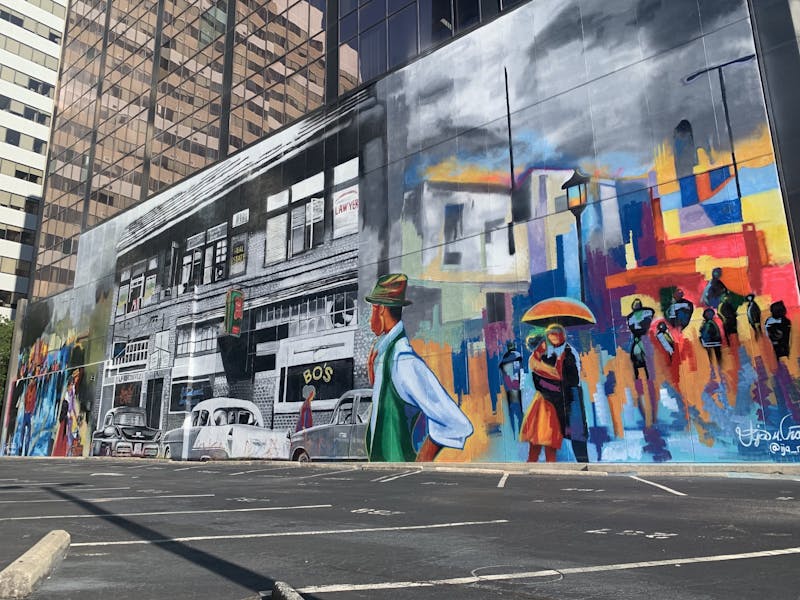 Ija Charles completes mural on Main Street, continues to 'paint