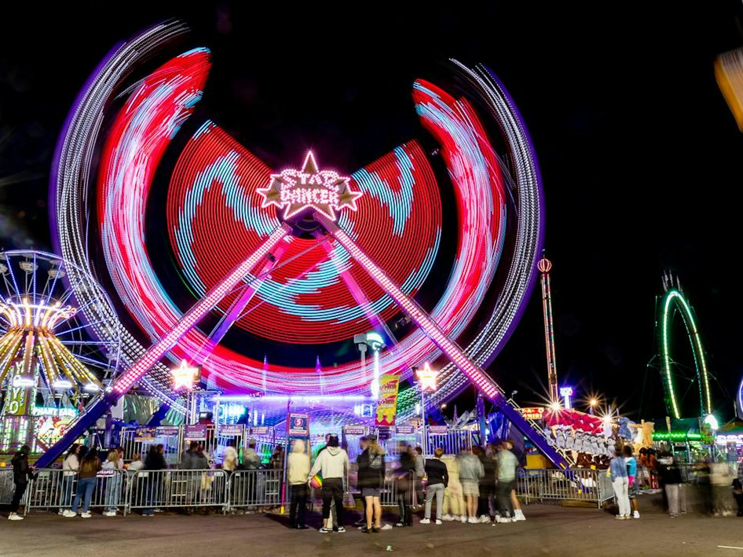 The over 70-foot-tall Star Dancer ride spins riders around at the South Carolina State Fair on Oct. 18, 2023. The ride holds up to 16 people at a time and spins up to 360 degrees both vertically and horizontally.