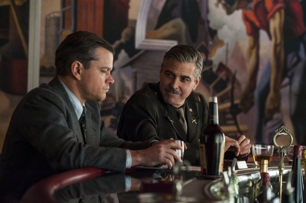 Actor Matt Damon, left, and actor/director George Clooney peform a scene on the set of the Columbia Pictures' movie, "The Monuments Men". (Columbia Pictures/MCT)