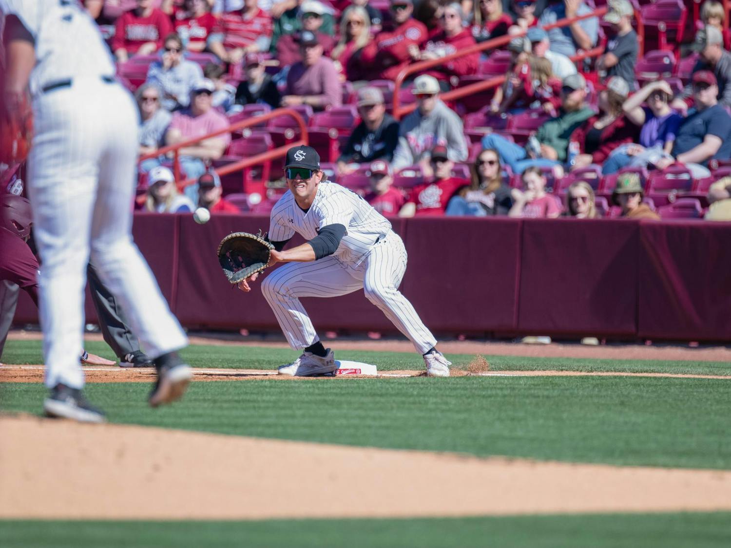 Senior infielder Tyler Causey attempts to catch a runner at first base during South Carolina's game against Texas A&amp;M on April 6, 2024. The Gamecocks lost 6-3 to the Aggies in the matchup.