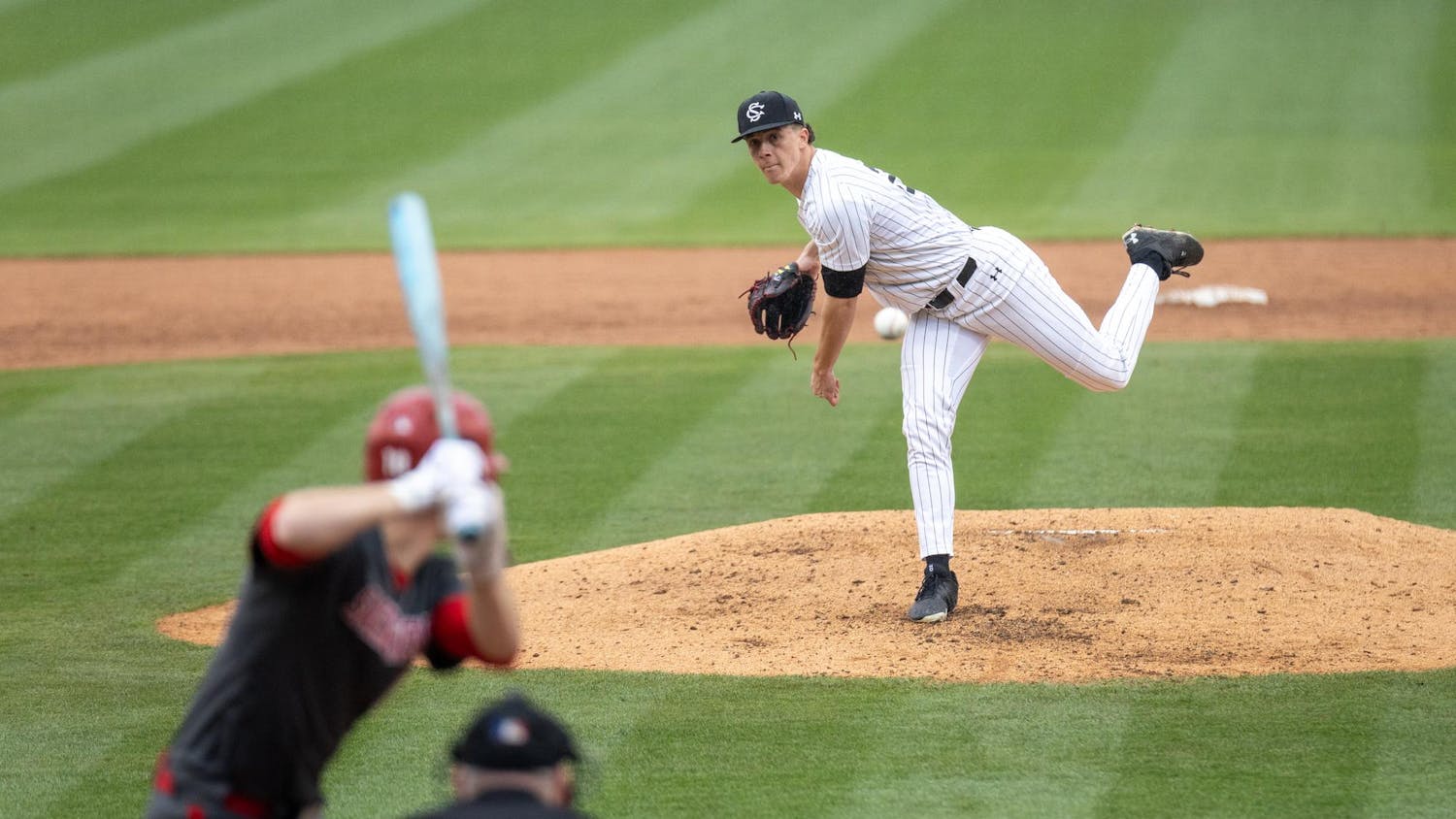 FILE — Senior pitcher Matthew Becker throws a pitch during a game against Sacred Heart University on Feb. 15, 2025, at Founders Park. Becker threw for five innings, earning nine strikeouts and allowing only one hit.