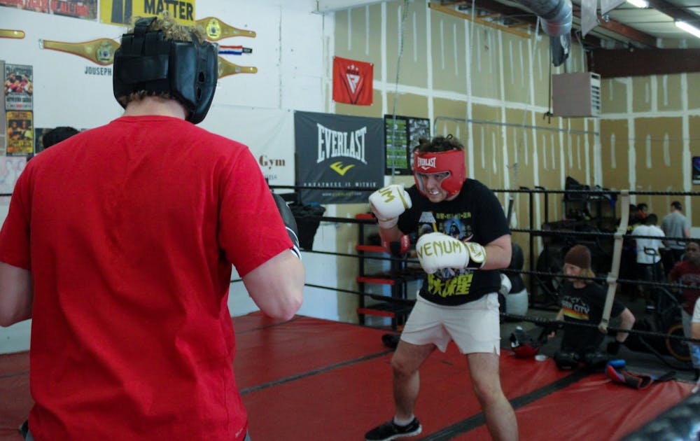 <p>Members of the Carolina Boxing Club engage in a live sparring session on Feb. 18, 2022.&nbsp;</p>