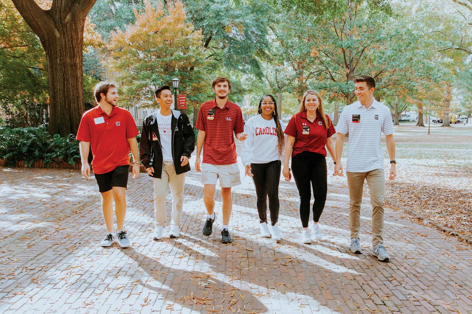 Members of the University Ambassadors team walk together on the Horseshoe. University Ambassadors help prospective students learn more about being a USC student.