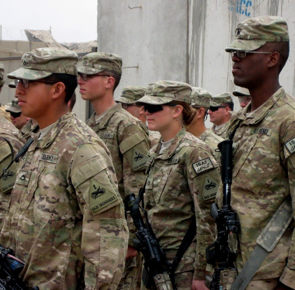Army Private First Class Rosie Darby stands in a formation at a combat outpost in the Zhari district of Kandahar province, Afghanistan on February 1, 2013. Her recruiter told her that women could not serve as front-line combat medics. (Alexandra Zavis/Los Angeles Times/TNS)