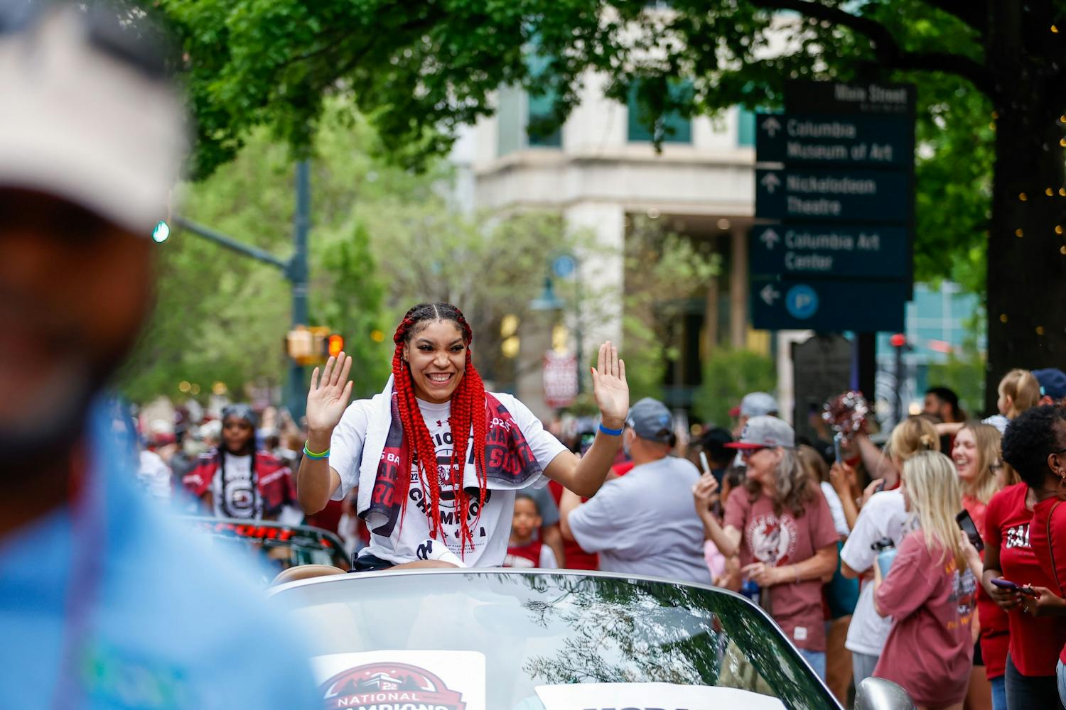 Senior forward Brea Beal waves from a car during a parade in honor of the Women’s Basketball team on April 13, 2022.&nbsp;
