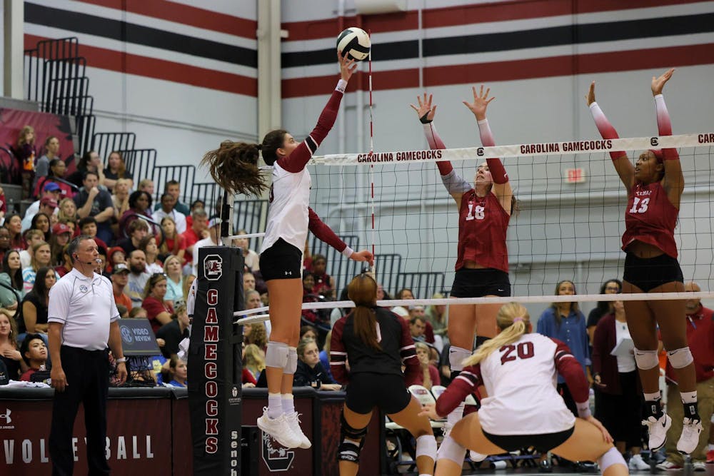 <p>Junior outside hitter Alayna Johnson tips the ball over the net in a match against Temple on Sept. 6, 2024. Johnson recorded eight kills, 26 attacks and 9 points for the Gamecocks in the team’s 3-0 win over the Owls.</p>