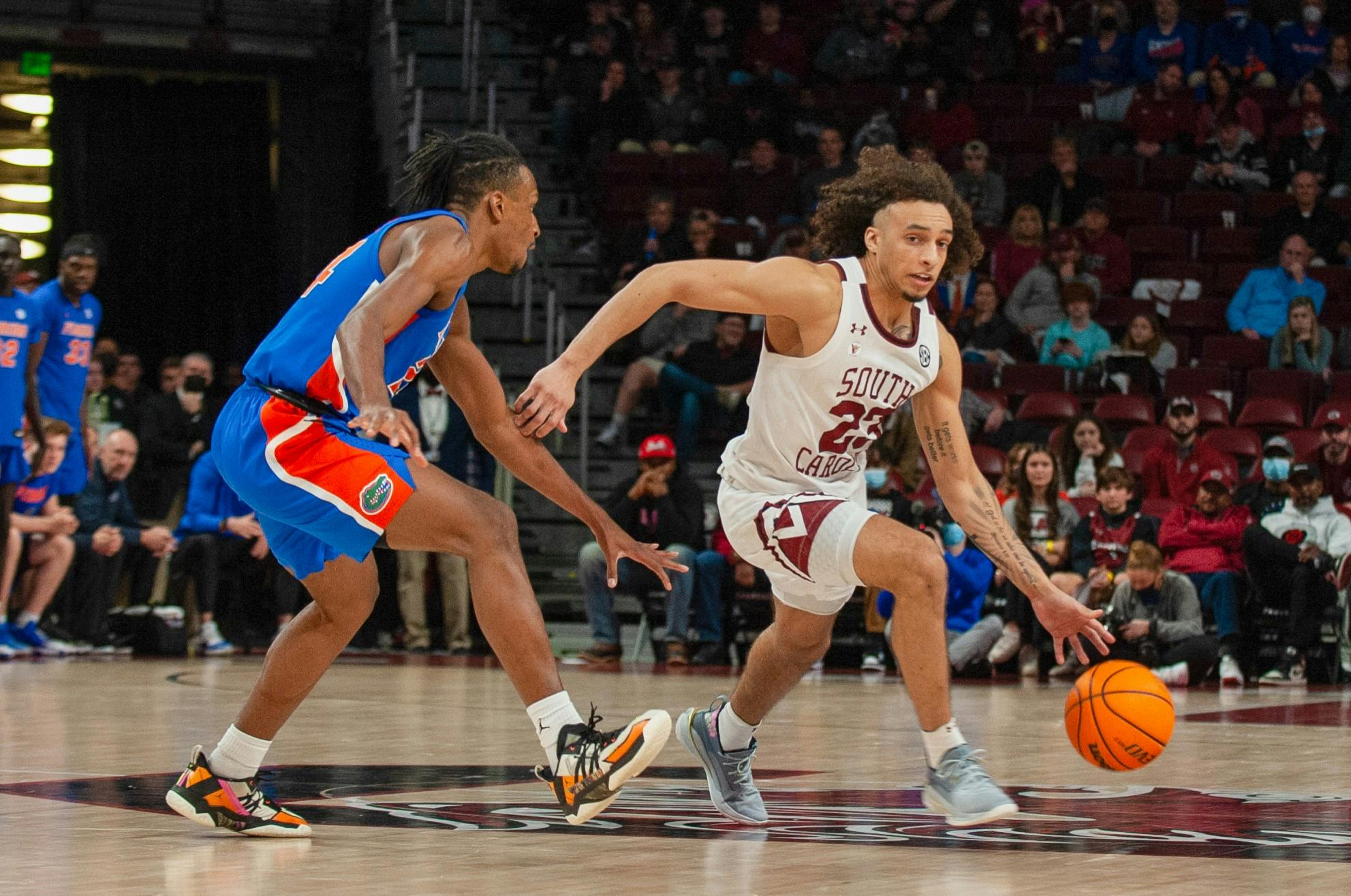 Freshman guard Devin Carter dribbles the ball around the defense in a conference game against the Florida Gators on Saturday, Jan. 15, 2021 in Columbia, SC. Carter played one of his best games of the season against Arkansas.