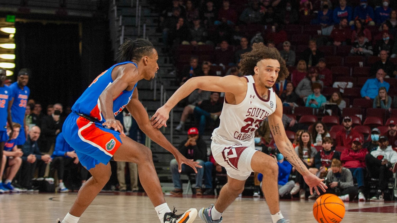Freshman guard Devin Carter dribbles the ball around the defense in a conference game against the Florida Gators on Saturday, Jan. 15, 2021 in Columbia, SC. Carter played one of his best games of the season against Arkansas.