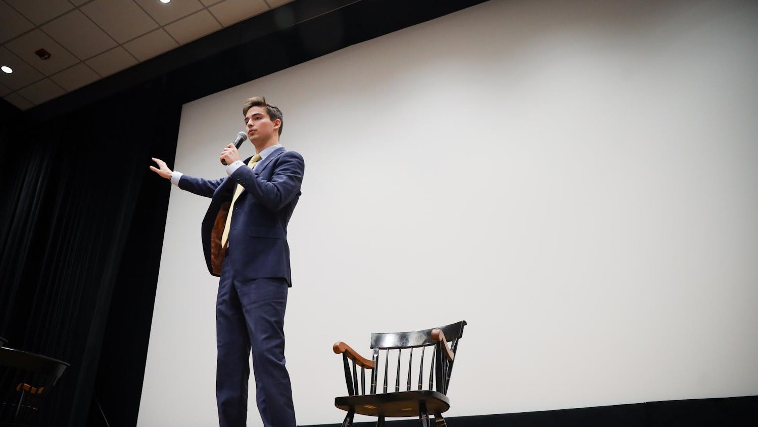 Patton Byars, the candidate for student body president, stands on stage during individual questioning of the Student Government debate on Feb. 14, 2024. Byars is running alongside Courtney Tkacs, a second-year public health and political science student, who plans to foster a better connection between Student Government and the student body.
