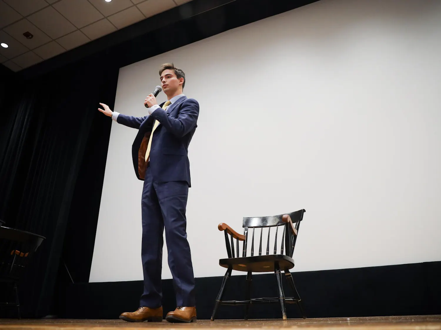 Patton Byars, the candidate for student body president, stands on stage during individual questioning of the Student Government debate on Feb. 14, 2024. Byars is running alongside Courtney Tkacs, a second-year public health and political science student, who plans to foster a better connection between Student Government and the student body.