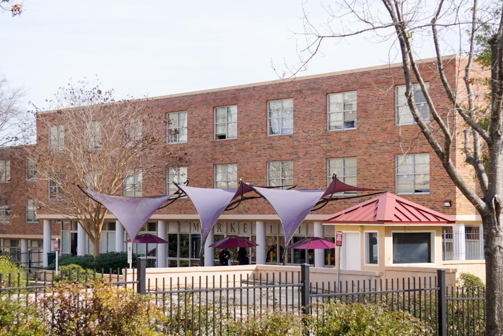 <p>McBryde Residence Hall stands behind the Thomas Cooper Library on Feb. 19, 2025. The USC board of trustees approved the dorm to be demolished in spring 2026 in order to build a new residence hall that better fits the university’s growing student population.</p>