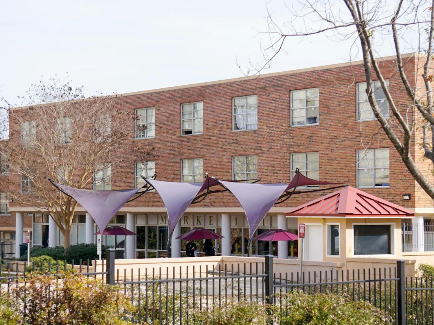 McBryde Residence Hall stands behind the Thomas Cooper Library on Feb. 19, 2025. The USC board of trustees approved the dorm to be demolished in spring 2026 in order to build a new residence hall that better fits the university’s growing student population.