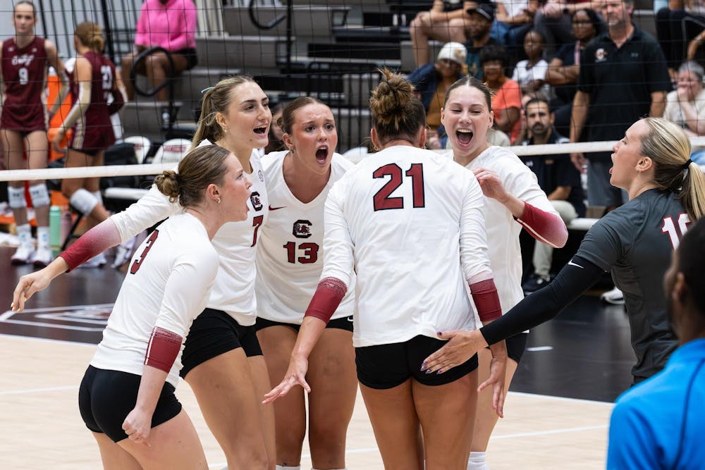 <p>The Gamecocks congratulate one another after winning a point at the exhibition against College of Charleston on Aug. 21, 2026, at the Carolina Volleyball Center.</p>