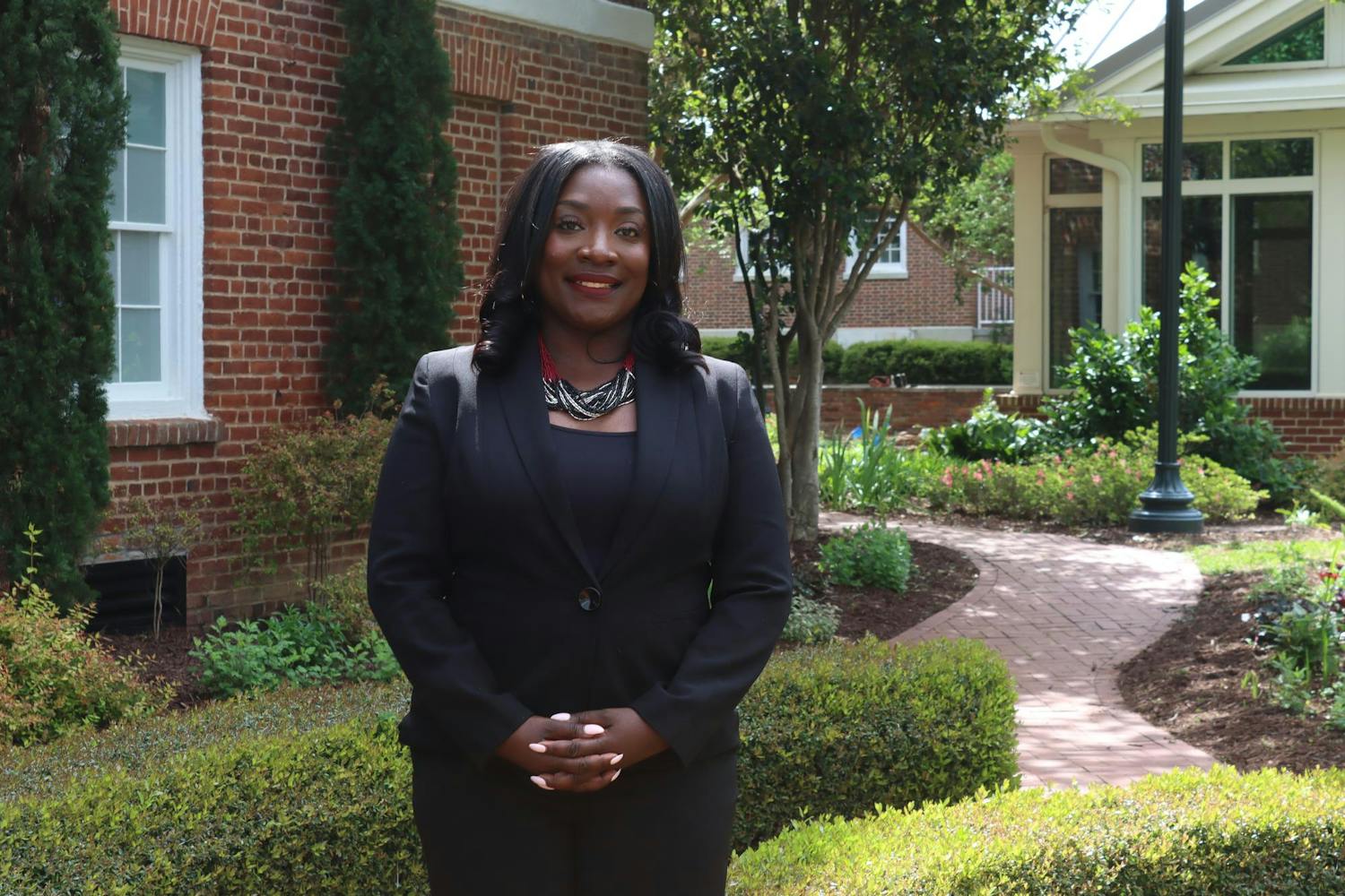 Dr. Rushonda James, the assistant dean of ɫɫƵ success for the College of Information and Communications, stands for a portrait in front of the School of Journalism and Mass Communication on April 10, 2024. James believes that women can be successful in any career path they choose.