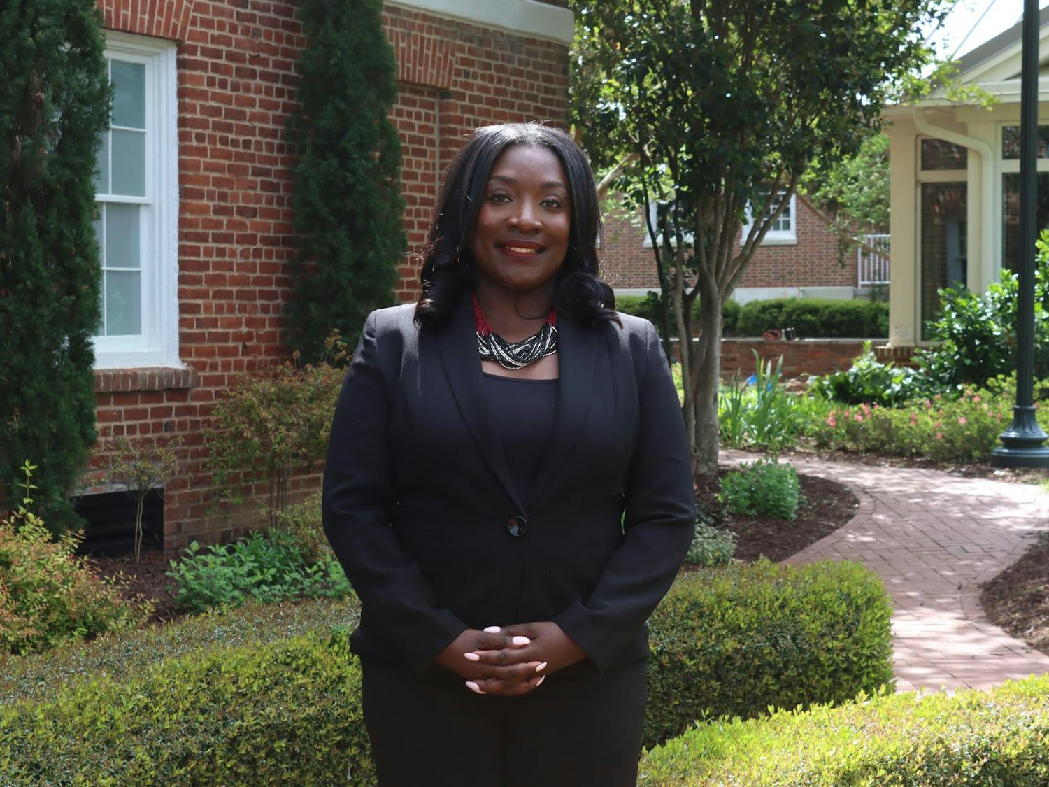 Dr. Rushonda James, the assistant dean of ɫɫƵ success for the College of Information and Communications, stands for a portrait in front of the School of Journalism and Mass Communication on April 10, 2024. James believes that women can be successful in any career path they choose.