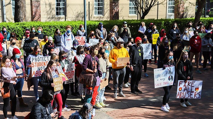 &nbsp;A shot of the crowd as they hold a variety of signs while at their second stop during the march, Gambrell Hall.&nbsp;