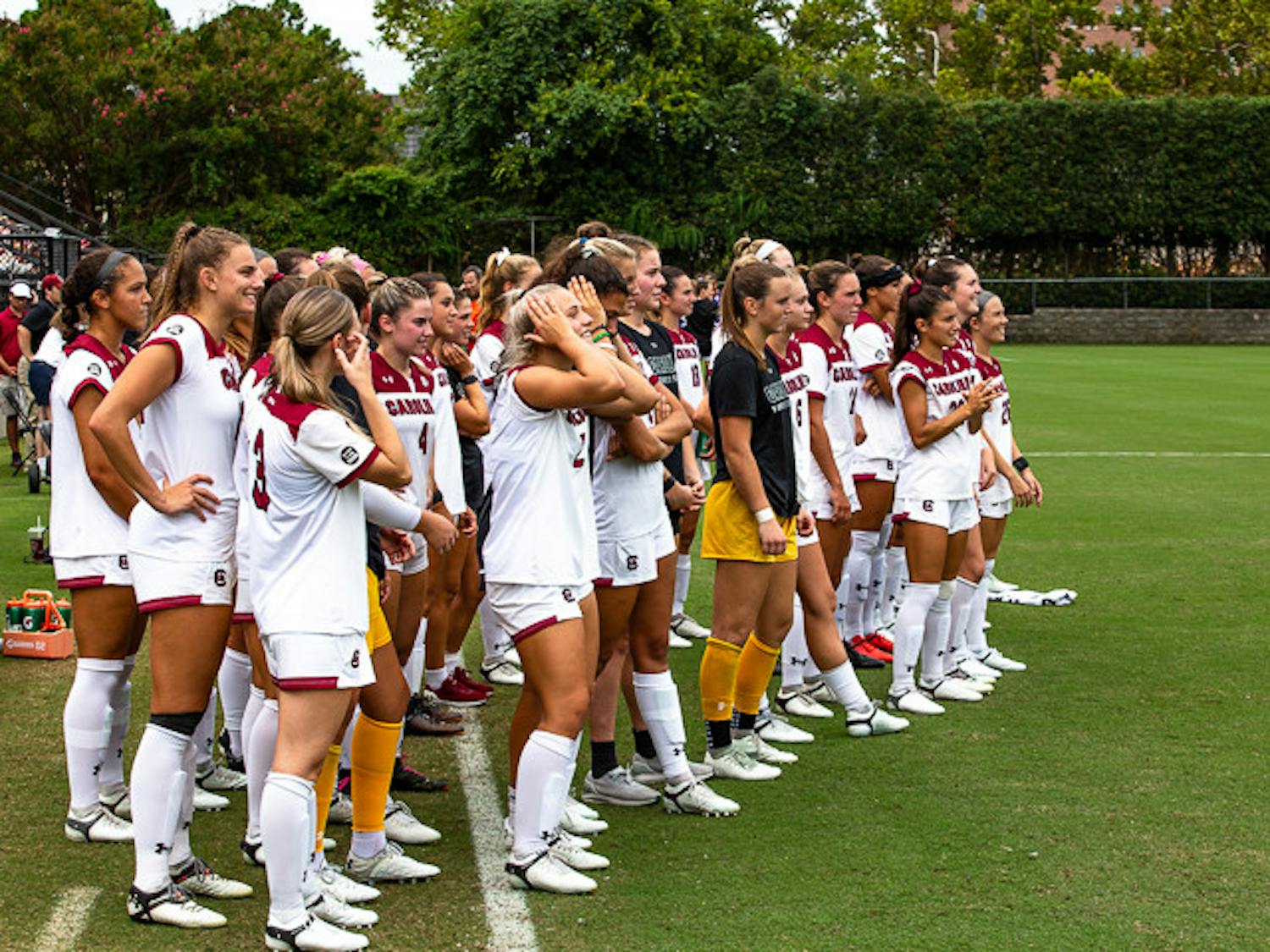 The South Carolina women's soccer team watch as the team's new intro video is unveiled during the Gamecocks matchup with Eastern Carolina matchup on August 21, 2022.