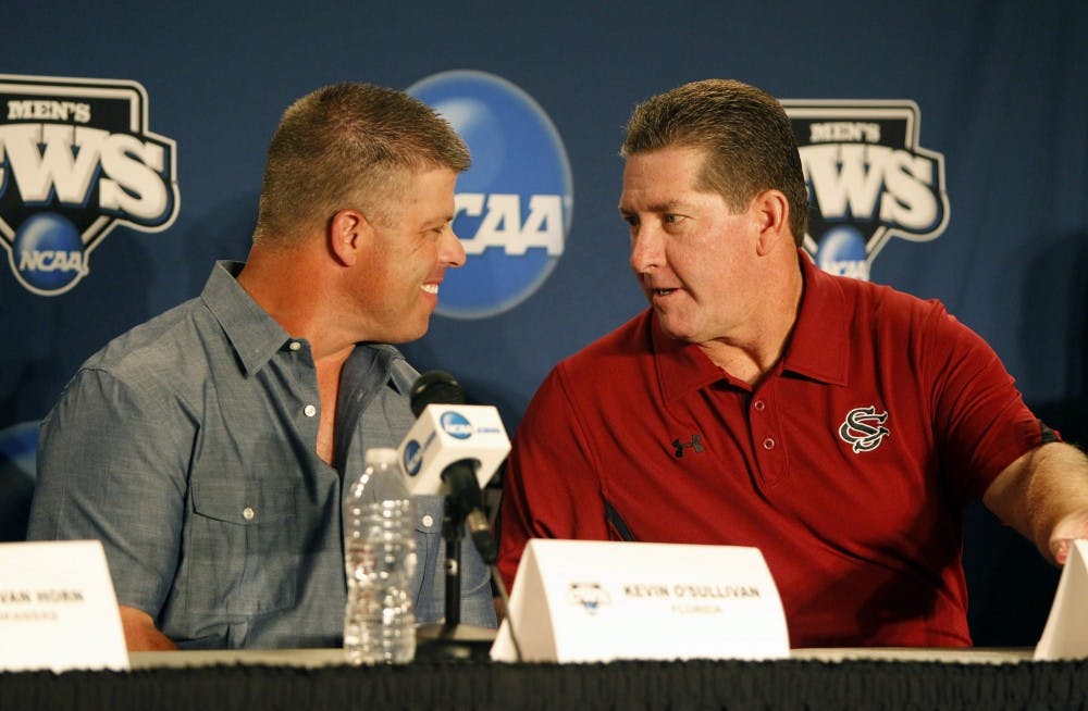 Florida head coach Kevin O'Sullivan, left, and South Carolina head coach Ray Tanner chat prior to a press conference in preparation for the College World Series at TD Ameritrade Park in Omaha, Nebraska, Thursday, June 14, 2012. (Gerry Melendez/The State/MCT)