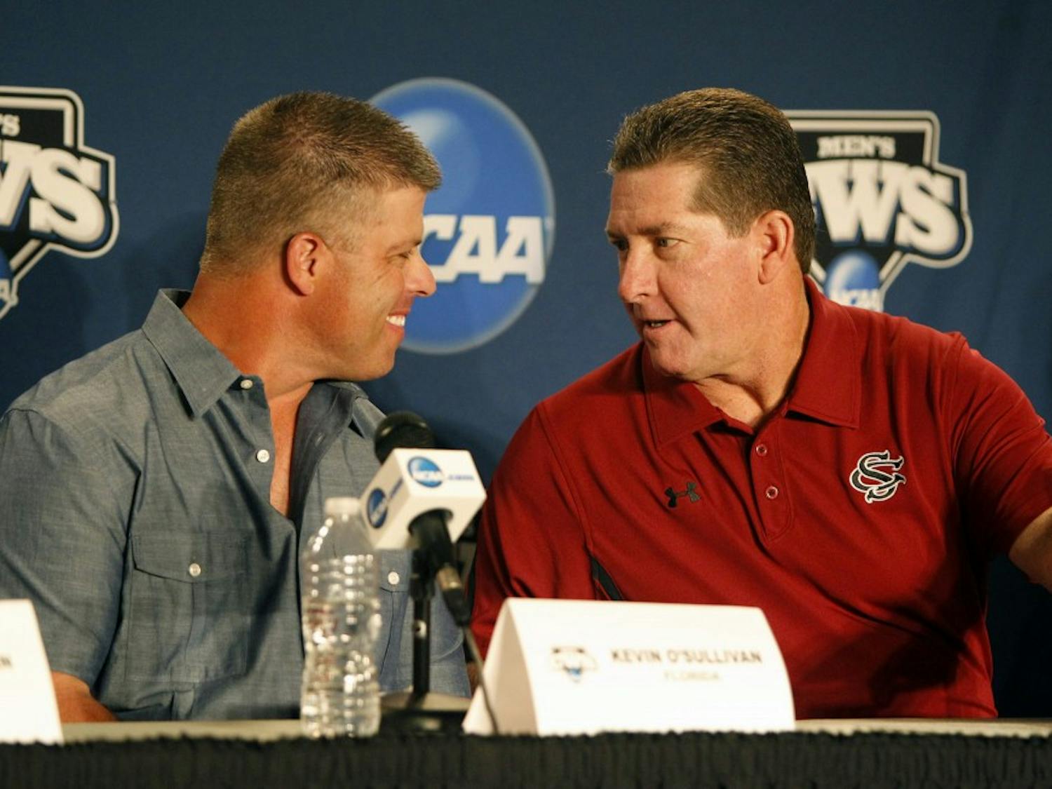 Florida head coach Kevin O'Sullivan, left, and South Carolina head coach Ray Tanner chat prior to a press conference in preparation for the College World Series at TD Ameritrade Park in Omaha, Nebraska, Thursday, June 14, 2012. (Gerry Melendez/The State/MCT)
