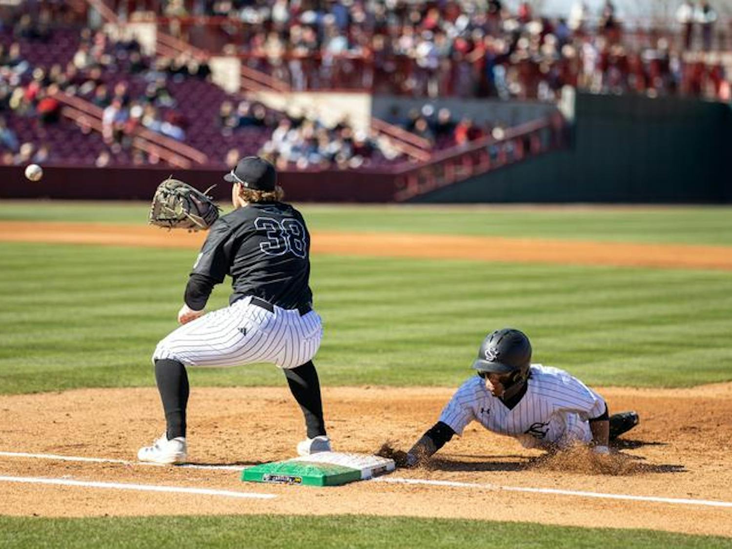 Senior infielder Jordan Carrion dives back to first base after a pickoff attempt from Milwaukee on Feb. 22, 2025 at Founders Park. The Gamecocks defeated the Panthers 6-3 and are 8-0 on the season.