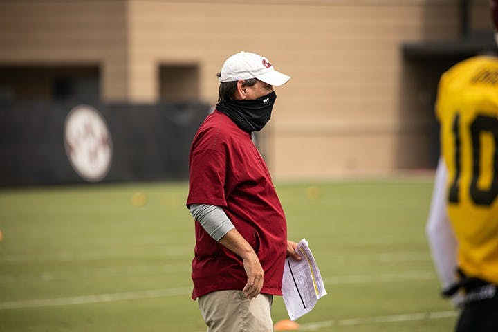Interim head coach Mike Bobo watches practice from the sidelines during summer training camp. Bobo was named interim head coach Sunday after Will Muschamp was fired.