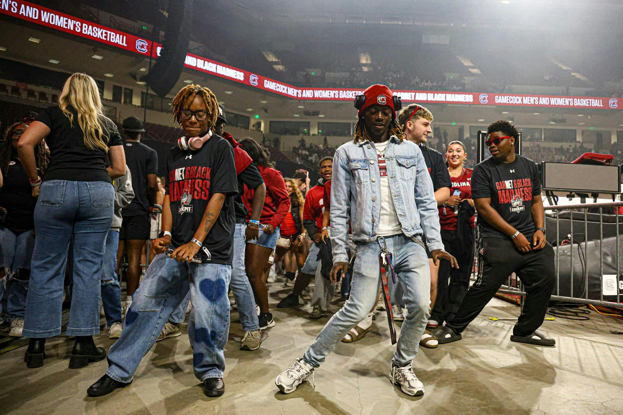 Students in the pit dance to "FLEX" by artist CUPID at GarNET &amp; Black Madness on Oct. 21, 2025, at Colonial Life Arena. The pit was packed with students anticipating the concert of American rapper Waka Flocka Flame.