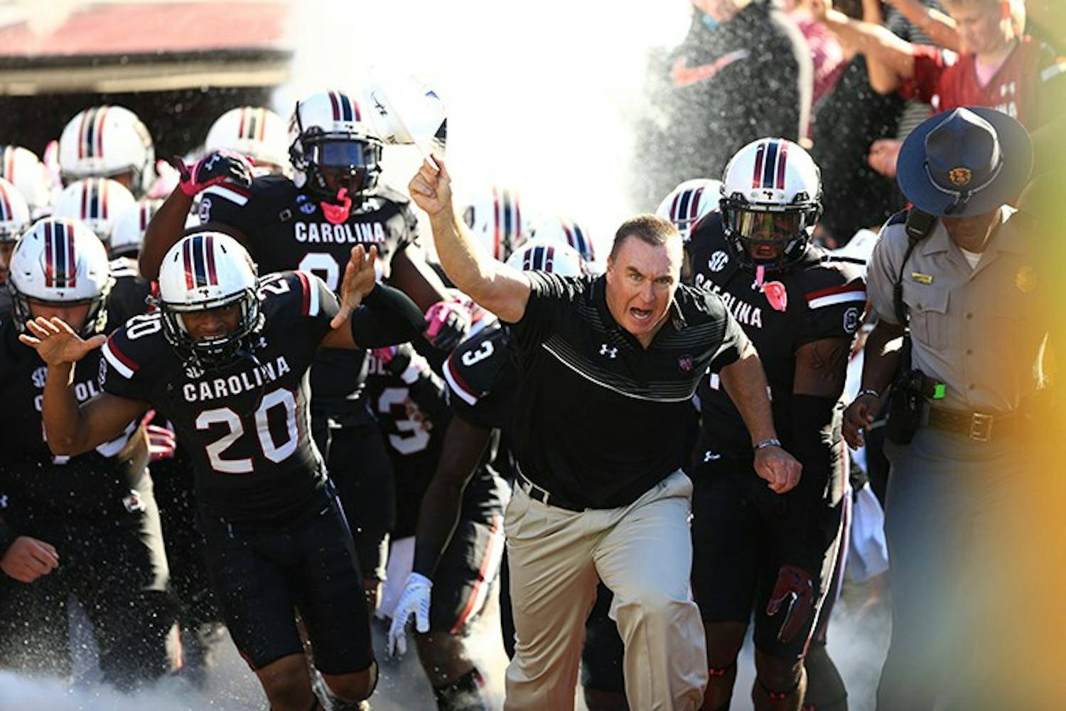 Head Coach Shawn Elliott rushes out with the Gamecocks. This was Elliott's first game as Head Coach. 