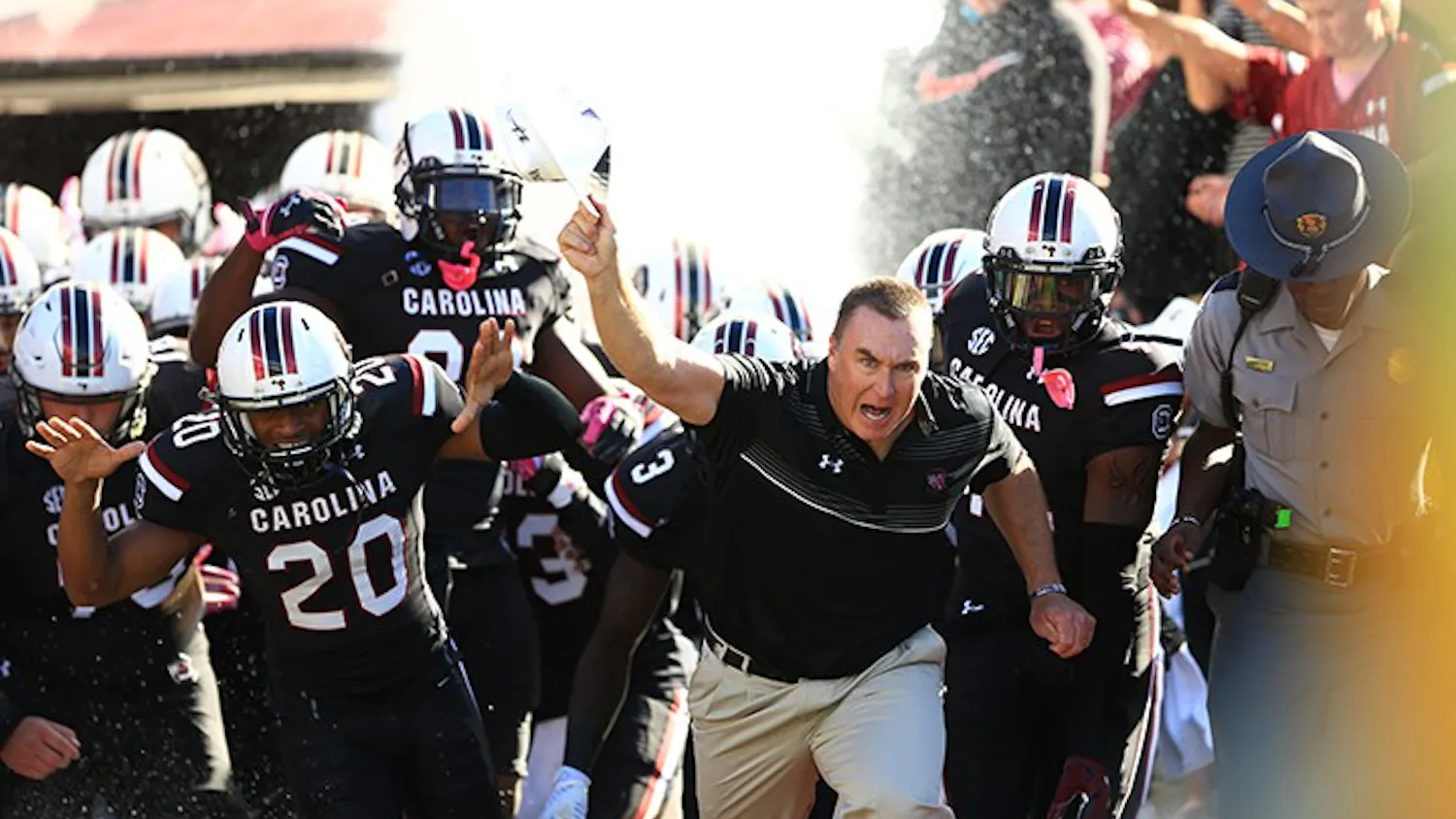 Head Coach Shawn Elliott rushes out with the Gamecocks. This was Elliott's first game as Head Coach.