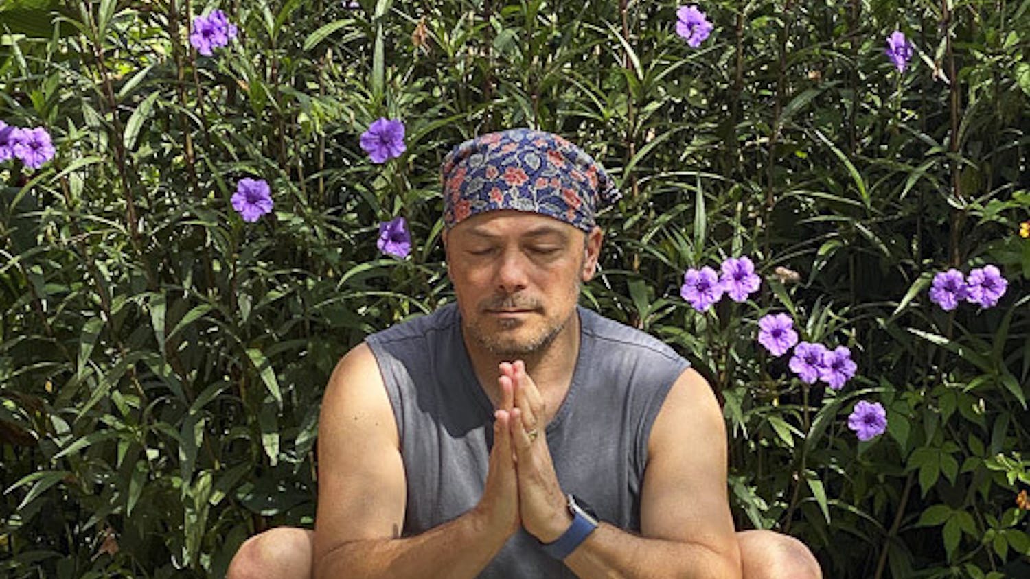 David Moscowitz, a professor at the School of Journalism and Mass Communications sits in the Malasana pose, a.k.a. the Garland pose on Sept. 5, 2020. Moscowitz offers donation funded yoga lessons at Rooted Yoga, on Sunday afternoons.&nbsp;