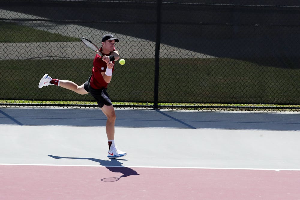 Junior Daniel Rodrigues hits a backhand at the Carolina Tennis Center on Sunday, March 20, 2022. The Gamecocks beat the Ole Miss Rebels 6-1.