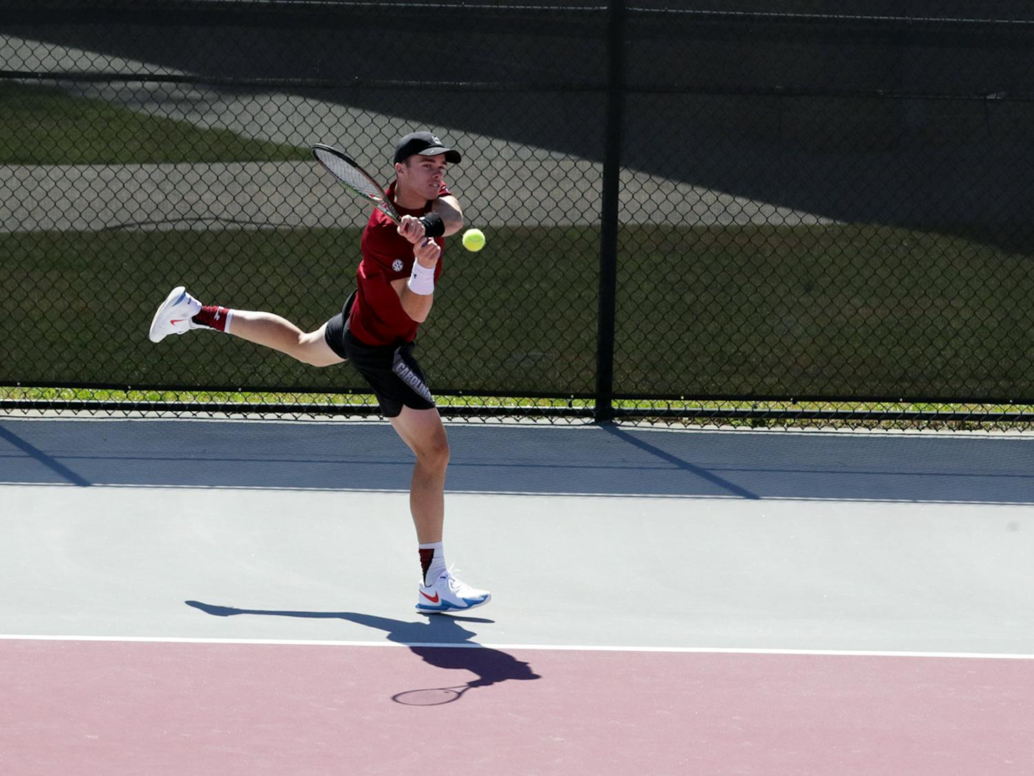 Junior Daniel Rodrigues hits a backhand at the Carolina Tennis Center on Sunday, March 20, 2022. The Gamecocks beat the Ole Miss Rebels 6-1.