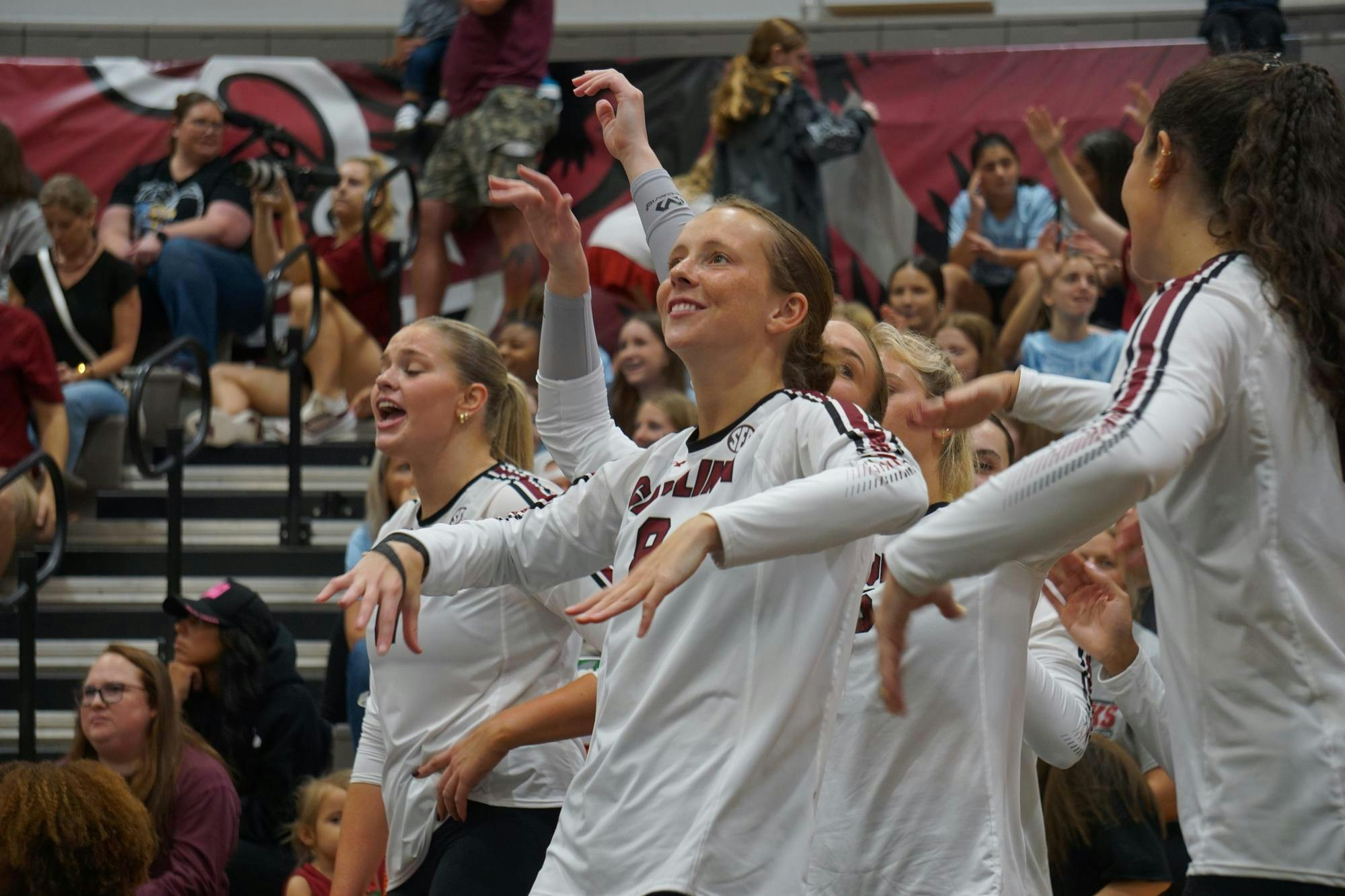 Freshman defensive specialist Anne Bradley Bing celebrates with the other players after the Gamecocks receive a point against Georgia at the Carolina Volleyball Center on Oct. 5, 2025.