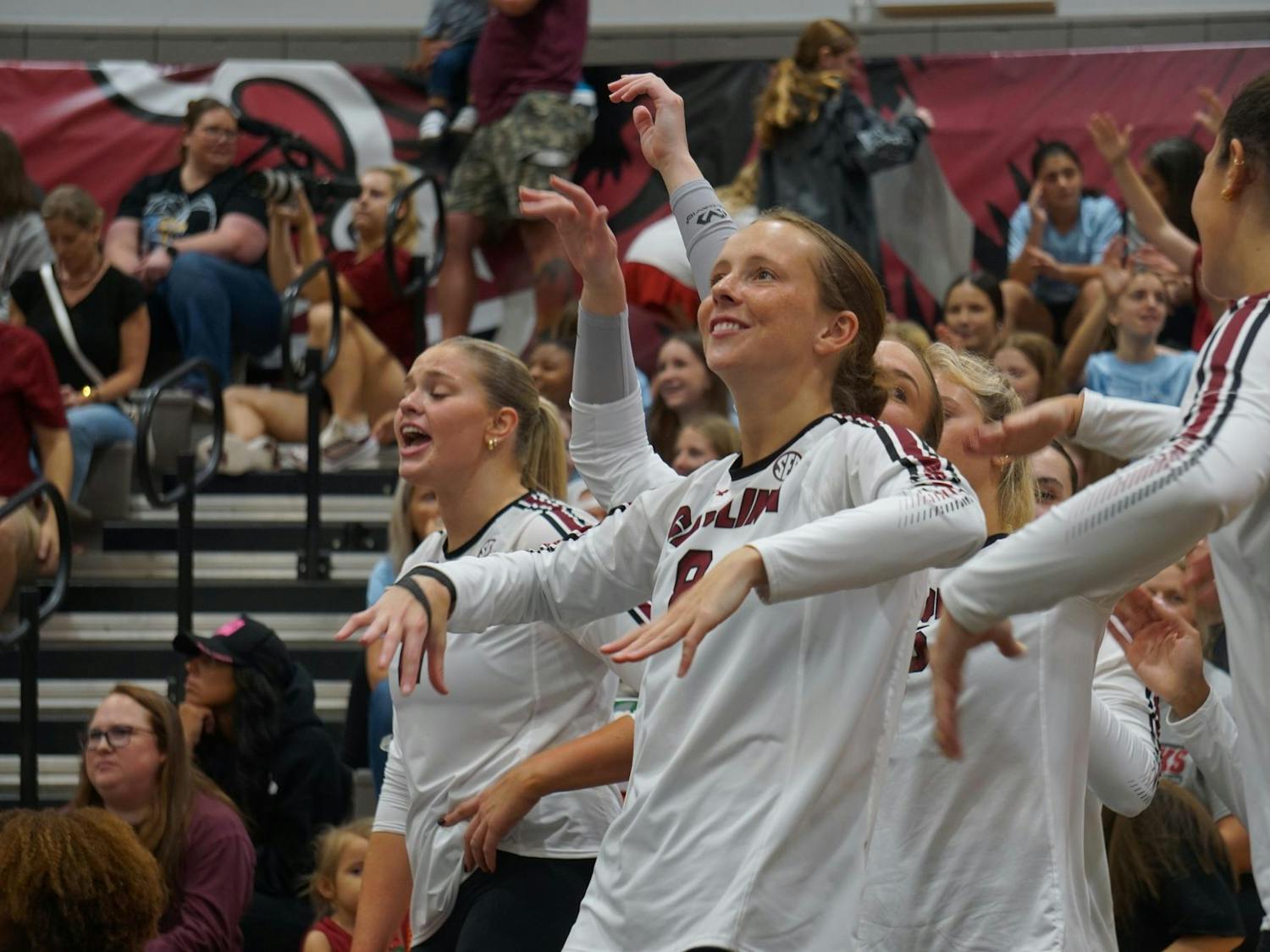 Freshman defensive specialist Anne Bradley Bing celebrates with the other players after the Gamecocks receive a point against Georgia at the Carolina Volleyball Center on Oct. 5, 2025.