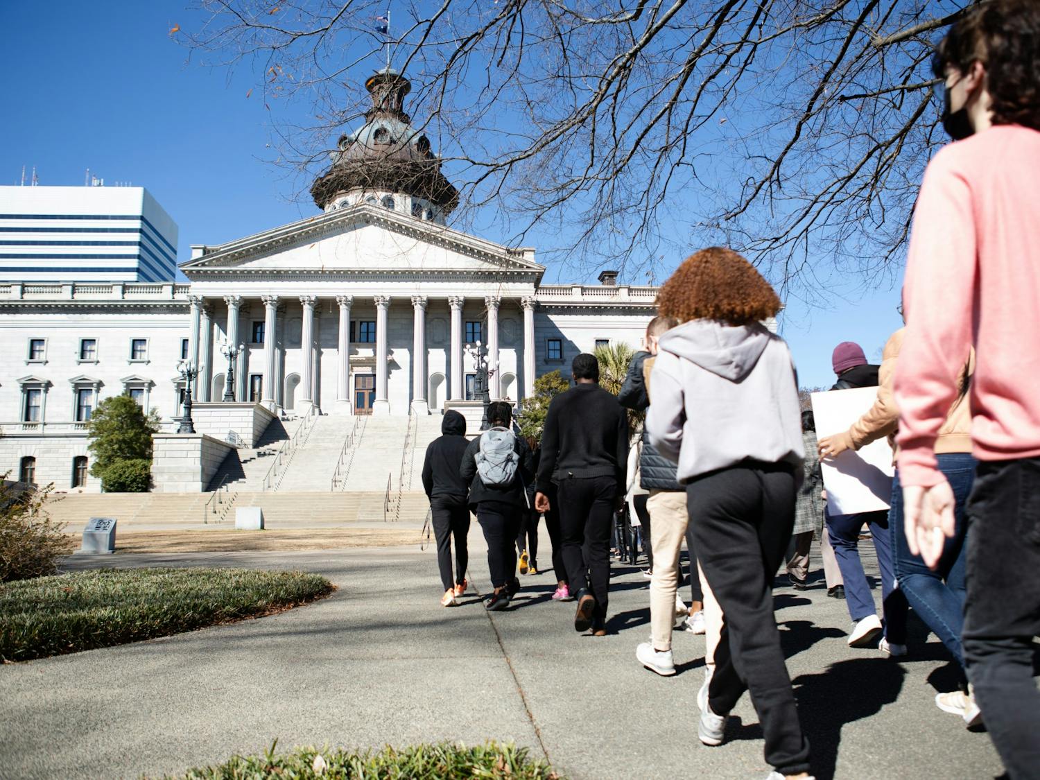 The protestors reach the back of the statehouse on Feb. 5, 2022. Protesters took aim at the SC legislature over controversies surrounding the S.C. Heritage Act, which serves to protect certain statues and monuments tied to state history.