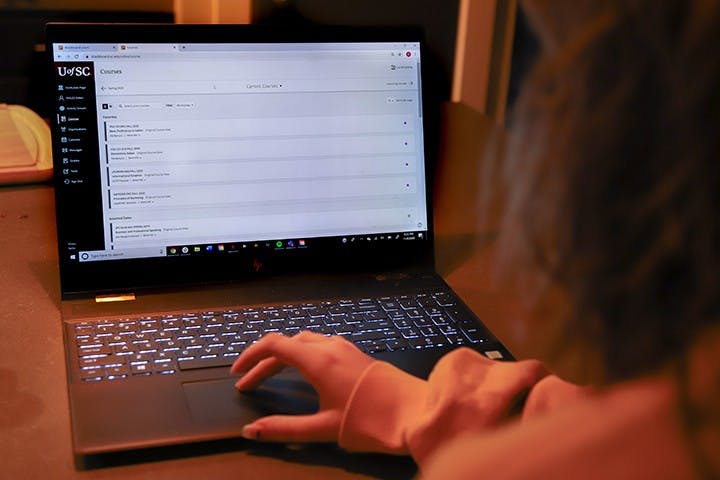 A student uses Blackboard on a laptop. Blackboard is one of the ways teachers share course information, assignments and tests, and sometimes classes are held using Blackboard Collaborate.