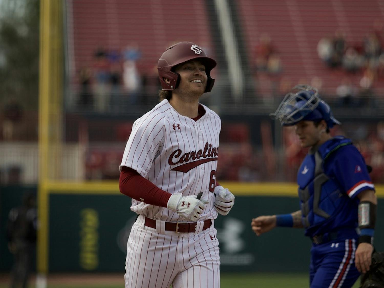 Fifth-year infielder Will McGillis grins after firing a home run into the stands and putting the Gamecocks up 17-3 on UMass Lowell on Feb. 17, 2023. The Gamecocks finished the night with a 20-3 victory. &nbsp;