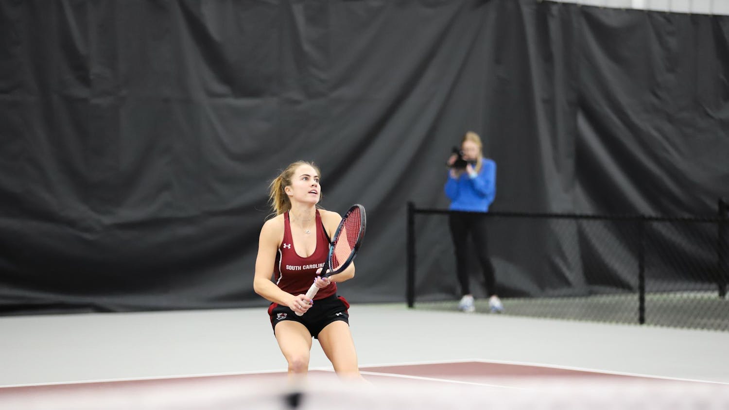 Junior Sarah Hamner lines up for a shot while playing singles on Jan. 21, 2024, at the Carolina Indoor Tennis Center. Hamner won both her singles and doubles matches against Presbyterian.