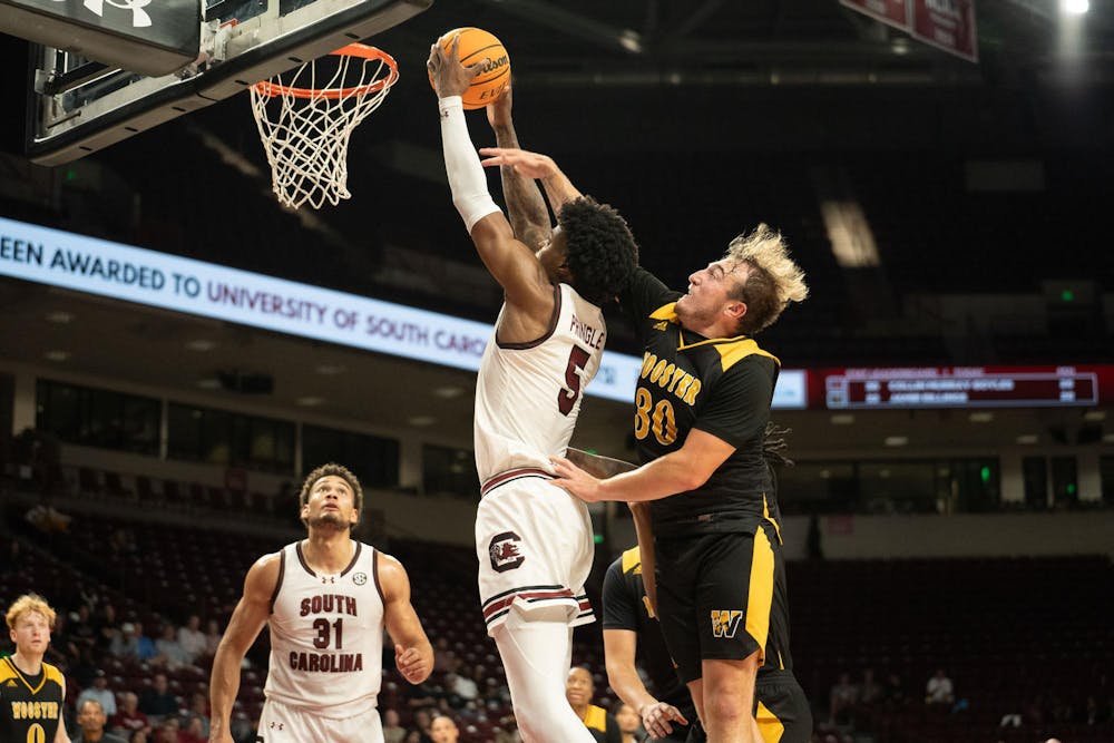 <p>FILE — Graduate student forward Nick Pringle dunks and gets an "and-one" called after getting fouled by Wooster defenders during Oct. 30, 2024 matchup at the Colonial Life Arena. Pringle scored 13 points in the Gamecocks' game against No. 16 Indiana.</p>